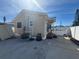 Exterior view featuring the side of the house with a patio at 13331 1St E St, Madeira Beach, FL 33708