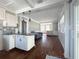 Open kitchen view with countertop seating and natural light at 13331 1St E St, Madeira Beach, FL 33708