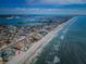 Breathtaking aerial view of the beachfront property with a pool, overlooking the ocean and coastline on a clear day at 15912 Gulf Blvd, Redington Beach, FL 33708