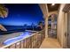 Nighttime view of a luxurious backyard featuring a pool and access to the beach, under a star-filled sky at 15912 Gulf Blvd, Redington Beach, FL 33708