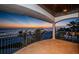 Covered balcony with ocean view at dusk, perfect for enjoying the serene evening ambiance at 15912 Gulf Blvd, Redington Beach, FL 33708