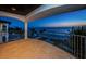 Balcony offers oceanfront serenity at twilight; ideal for peaceful evenings enjoying the gentle surf at 15912 Gulf Blvd, Redington Beach, FL 33708