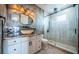 Modern bathroom features a granite countertop, vessel sink, and a glass-enclosed shower at 15912 Gulf Blvd, Redington Beach, FL 33708