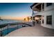 Luxury home boasting ocean views, a balcony, and a stunning sunset at 15912 Gulf Blvd, Redington Beach, FL 33708