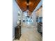 Hallway featuring decorative wood ceilings, arched doorways, and custom lighting at 15912 Gulf Blvd, Redington Beach, FL 33708