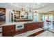 Gourmet kitchen boasts a large center island with marble countertops and stainless steel microwave at 15912 Gulf Blvd, Redington Beach, FL 33708