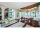 Elegant living room featuring decorative chandelier, marble floors and beautiful ocean views at 15912 Gulf Blvd, Redington Beach, FL 33708