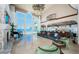 Bright living room with floor-to-ceiling windows offering stunning ocean views, elegant fireplace and decor at 15912 Gulf Blvd, Redington Beach, FL 33708