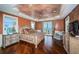 Luxurious main bedroom with ocean view, hardwood floors, and ornate furnishings at 15912 Gulf Blvd, Redington Beach, FL 33708