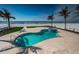 Beautiful beachside pool area with lush landscaping and ocean views at 15912 Gulf Blvd, Redington Beach, FL 33708