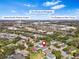 Neighborhood aerial view showcasing a home's proximity to shops and medical facilities at 1645 Fennsbury Ct, Wesley Chapel, FL 33544