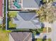 Aerial view of a home with a gray roof, surrounded by a fenced-in backyard at 1645 Fennsbury Ct, Wesley Chapel, FL 33544