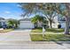 Charming single-Gathering home with a well-manicured lawn, mature trees, and a two-car garage at 1645 Fennsbury Ct, Wesley Chapel, FL 33544