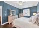 Calming main bedroom with dark wood floors, dresser, and a cozy atmosphere at 1645 Fennsbury Ct, Wesley Chapel, FL 33544