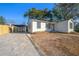 White house with new landscaping, driveway, and carport at 167 83Rd N Ave, St Petersburg, FL 33702