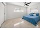 Bedroom featuring a ceiling fan, two windows, and a comfortable bed at 1672 Cambridge Dr, Clearwater, FL 33756