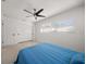 Bedroom featuring a ceiling fan, window, and a comfortable bed at 1672 Cambridge Dr, Clearwater, FL 33756