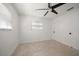 Clean bedroom with ceiling fan, window, and closet with sliding doors at 1672 Cambridge Dr, Clearwater, FL 33756