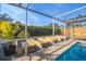 Relaxing pool with plant beds and a tropical feel at 1672 Cambridge Dr, Clearwater, FL 33756