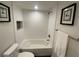 Bathroom with white tiled walls and a shower/tub combination with a toiletry niche at 2070 Lakeview Dr # 206, Clearwater, FL 33763