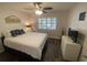 Comfortable bedroom with ceiling fan and a sunny window with white shutters at 2070 Lakeview Dr # 206, Clearwater, FL 33763