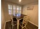 Cozy dining area features a dark wood table and chairs with decorative shuttered windows at 2070 Lakeview Dr # 206, Clearwater, FL 33763