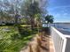 Beautifully landscaped grounds surround the community pool, complemented by lush greenery and lake views at 2070 Lakeview Dr # 206, Clearwater, FL 33763