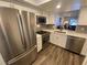 Modern kitchen with stainless steel appliances and sleek white cabinets at 2070 Lakeview Dr # 206, Clearwater, FL 33763