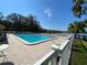 Community pool offers a refreshing escape with lounge chairs and scenic lake views for residents at 2070 Lakeview Dr # 206, Clearwater, FL 33763