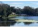 Scenic lake view with a pier and water feature; building can be seen in the background at 2070 Lakeview Dr # 206, Clearwater, FL 33763