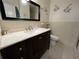 Bathroom featuring vanity with marble countertop, a framed mirror and fish decorations at 2226 Switzerland Way # 52, Clearwater, FL 33763