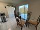 Charming dining area with glass table and four chairs set near a bright window view at 2226 Switzerland Way # 52, Clearwater, FL 33763