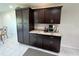 Kitchen featuring dark cabinetry, stainless steel appliances and light countertops at 2226 Switzerland Way # 52, Clearwater, FL 33763