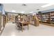 Library interior featuring shelves packed with books and a center table at 2226 Switzerland Way # 52, Clearwater, FL 33763