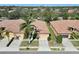 Aerial view of homes featuring tile roofs, well-manicured lawns, and mature landscaping at 237 Shell Falls Dr, Apollo Beach, FL 33572