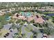 Aerial view of the clubhouse featuring a resort-style pool, sun deck, and well-maintained landscaping at 237 Shell Falls Dr, Apollo Beach, FL 33572