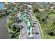 Stunning aerial view of the community entrance with a beautiful water feature and lush landscaping at 237 Shell Falls Dr, Apollo Beach, FL 33572