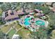 Aerial view of community featuring a resort-style pool, sun deck, and mature landscaping at 237 Shell Falls Dr, Apollo Beach, FL 33572