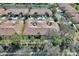 Aerial view of home with tile roof and lush landscaping at 237 Shell Falls Dr, Apollo Beach, FL 33572