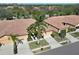 Aerial view of the community showcasing tile roofs, well-manicured lawns, and mature trees at 237 Shell Falls Dr, Apollo Beach, FL 33572