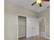 Neutral bedroom featuring a closet with sliding doors and an overhead light fixture at 237 Shell Falls Dr, Apollo Beach, FL 33572