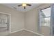 Bedroom with window, ceiling fan and a bathroom en suite at 237 Shell Falls Dr, Apollo Beach, FL 33572