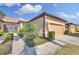 Beautiful single-story home featuring a tile roof, attached garage, and lush landscaping at 237 Shell Falls Dr, Apollo Beach, FL 33572