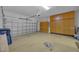 Spacious garage with attached shelving, and a blue toolbox at 237 Shell Falls Dr, Apollo Beach, FL 33572