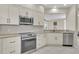 Well-equipped kitchen with stainless steel appliances, ample counter space, and white cabinetry at 237 Shell Falls Dr, Apollo Beach, FL 33572