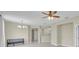 Open floor plan showcases living room with a chandelier and a ceiling fan at 237 Shell Falls Dr, Apollo Beach, FL 33572