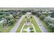 Aerial shot of meticulously landscaped entrance with central globe at 2441 Persian Dr # 53, Clearwater, FL 33763