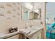 Bathroom with vanity, mirror and sink with access to the bedroom at 2441 Persian Dr # 53, Clearwater, FL 33763