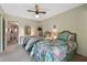 Bedroom boasts two matching beds, dressers, and ceiling fan at 2441 Persian Dr # 53, Clearwater, FL 33763