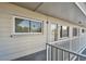 A covered walkway with railings leading to the entrance of unit #53 at 2441 Persian Dr # 53, Clearwater, FL 33763